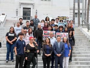 Students outside city hall with council member