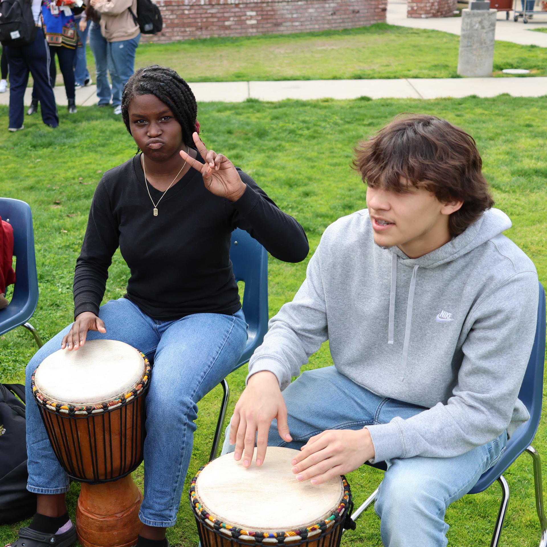 students and staff participating with the African Drum Interactive