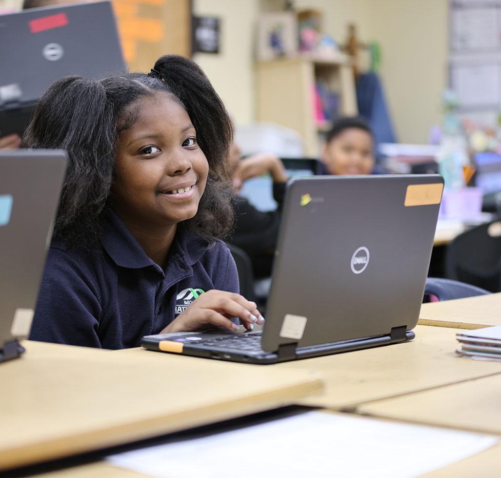 Student using a Chromebook in the classroom