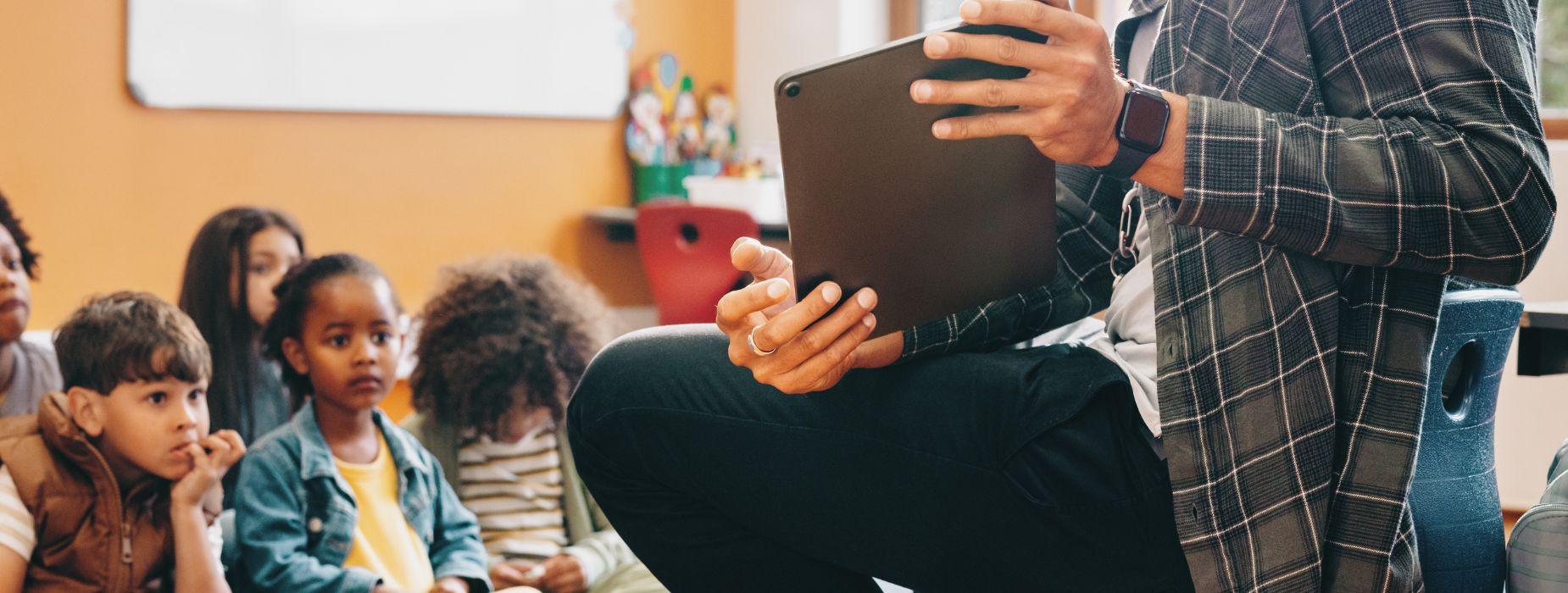 teacher using ipad tablet to teach