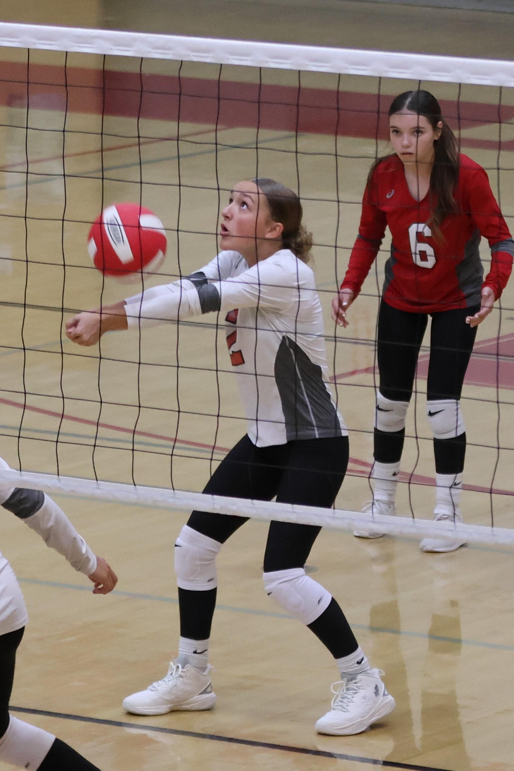junior varsity girls playing volleyball 69