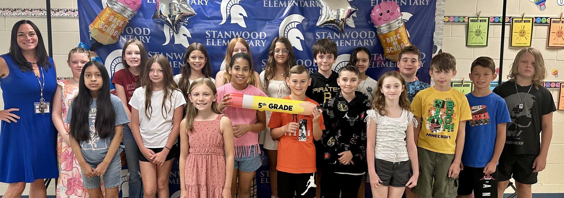 5th graders posing for the camera