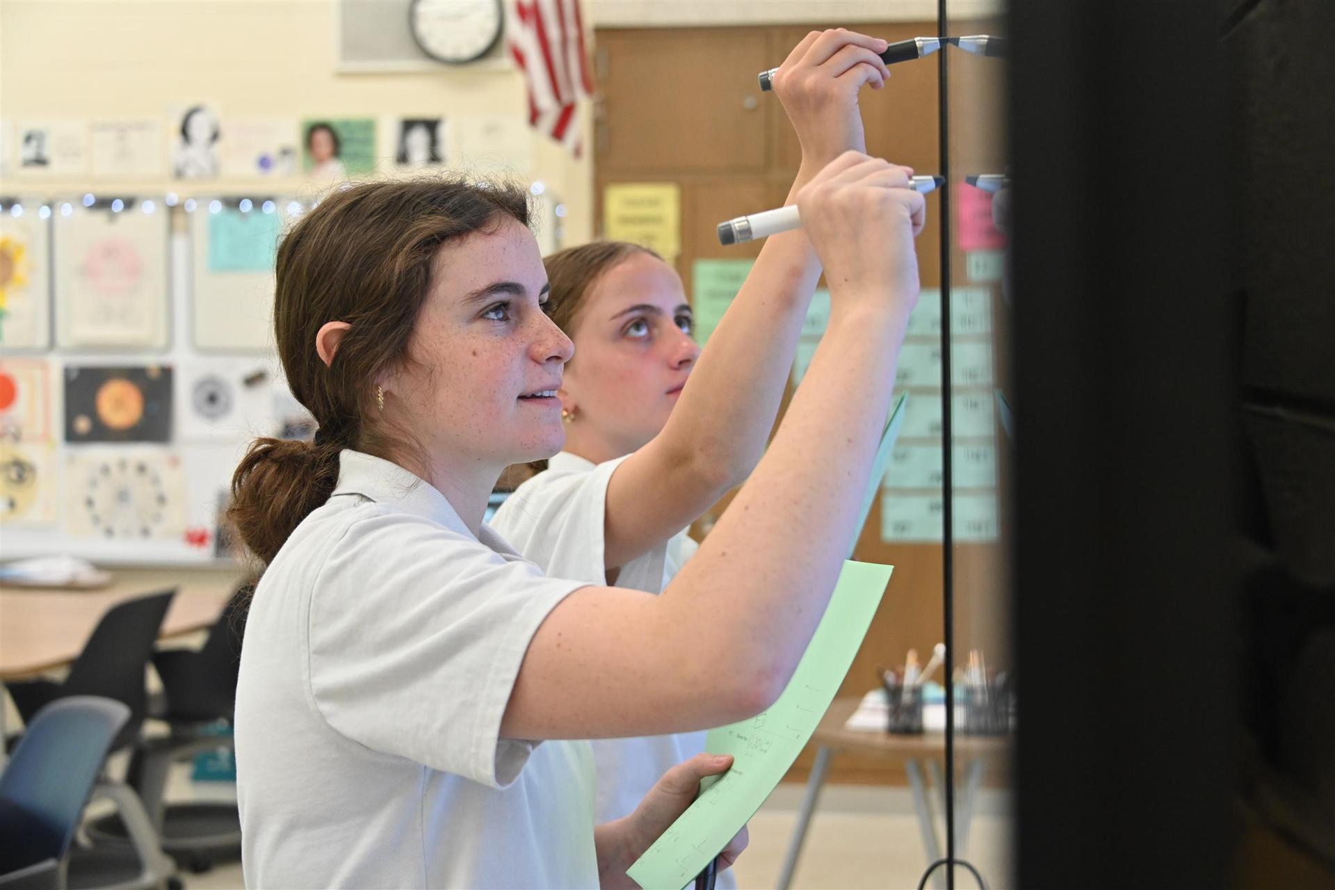  Students writing on board