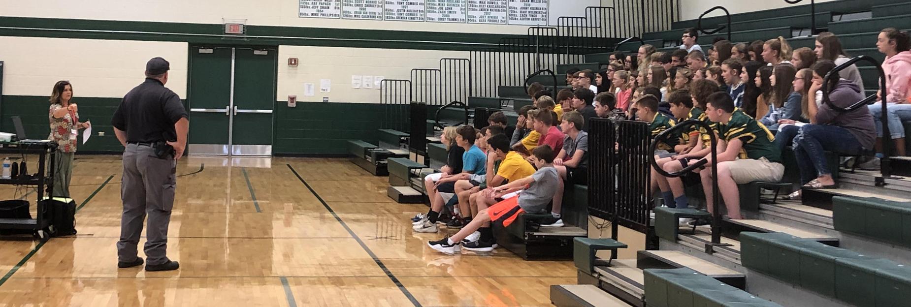 Officer Clark talks to the students