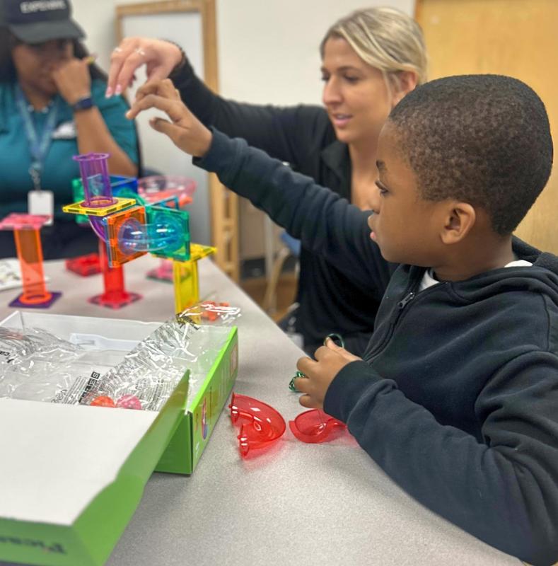 Student working with teacher.