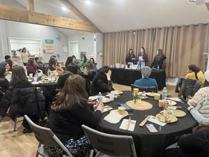 The mothers listen to a presentation on sour dough