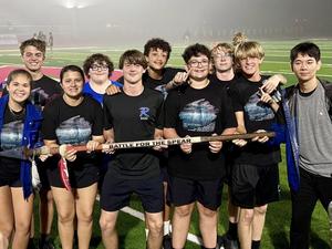 Redwater band students smile with trophy from their competition