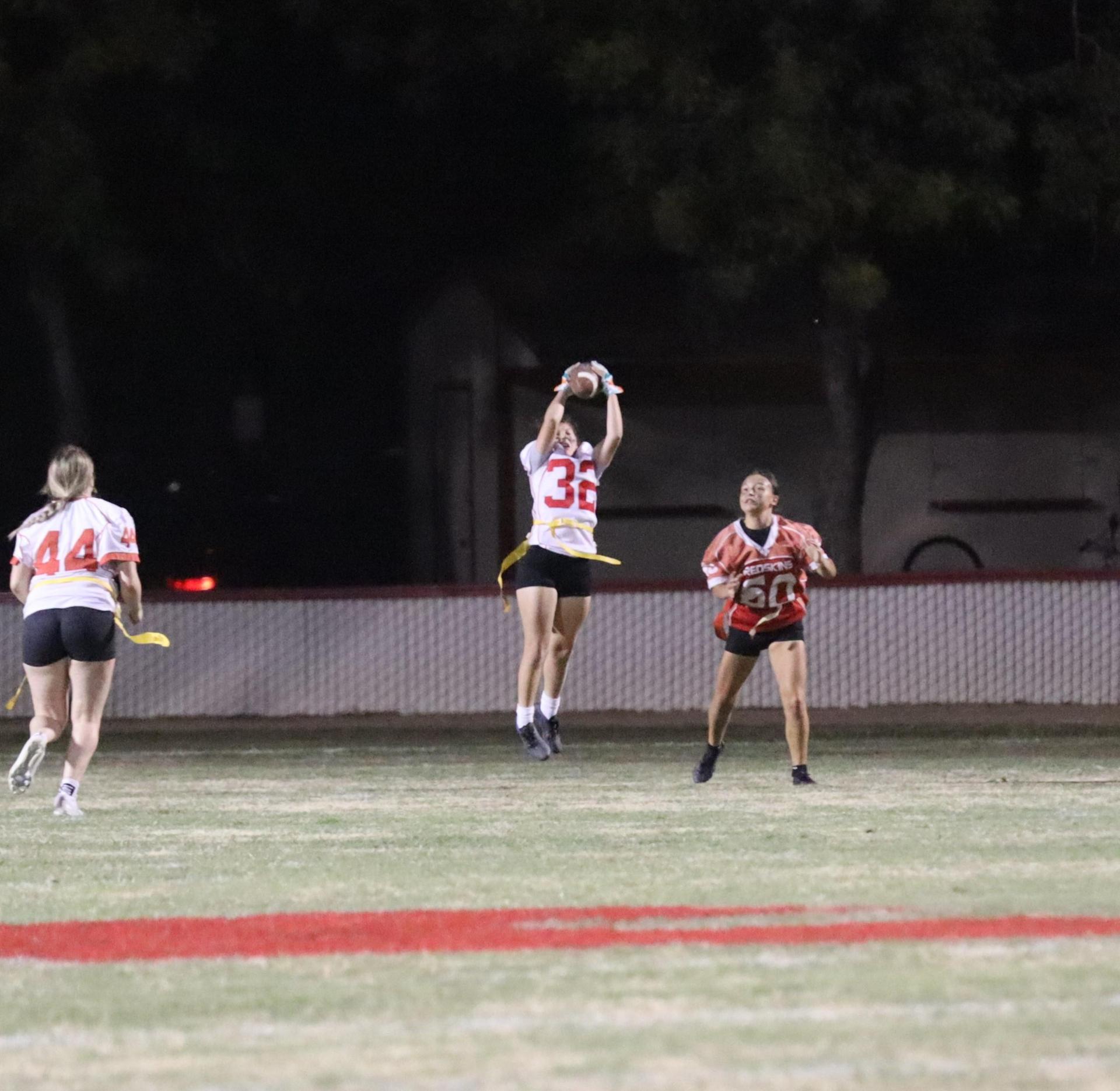 girls playing flag football