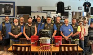 Members of the Mohawk Ramblers pose with can tabs