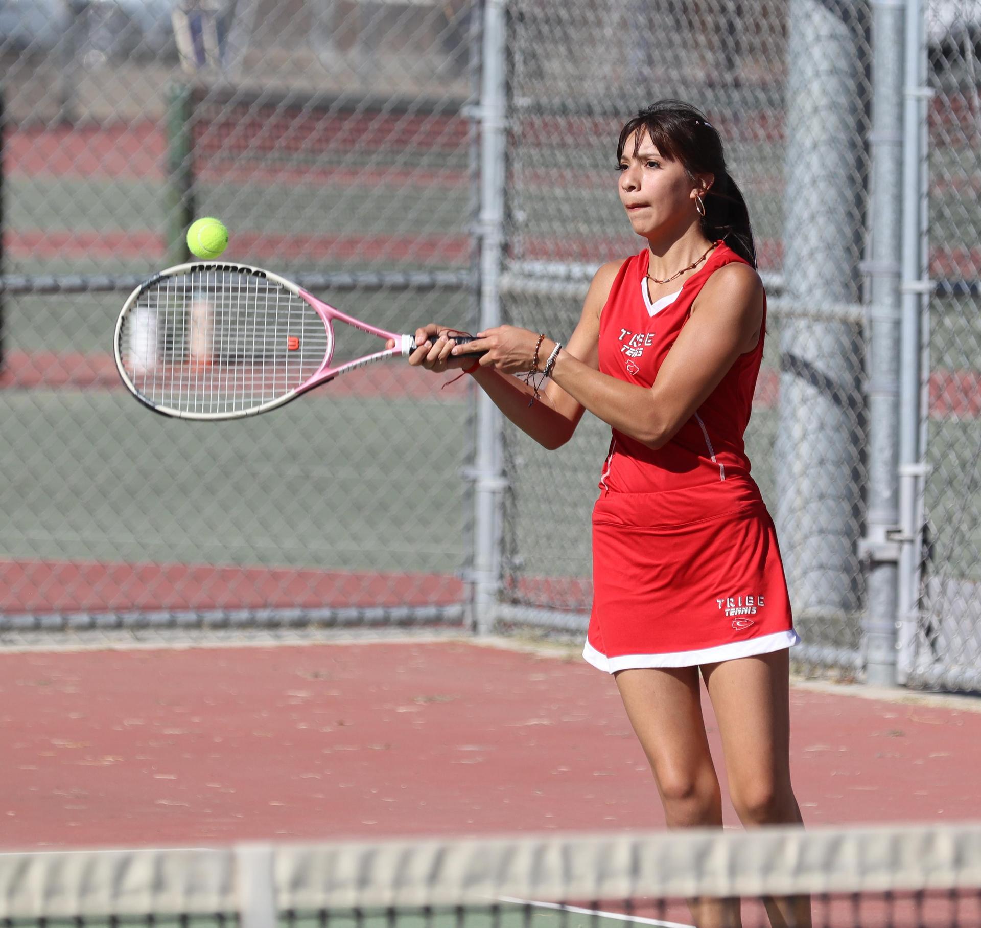 girls playing tennis against Golden Valley