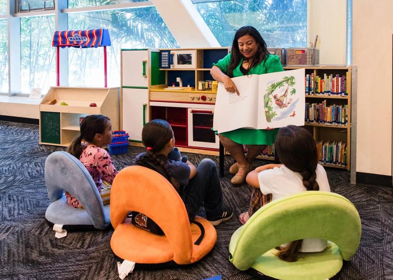 Karla Reading Book with Kids