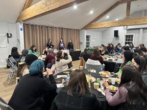 The mothers listen to a presentation on sourdough.