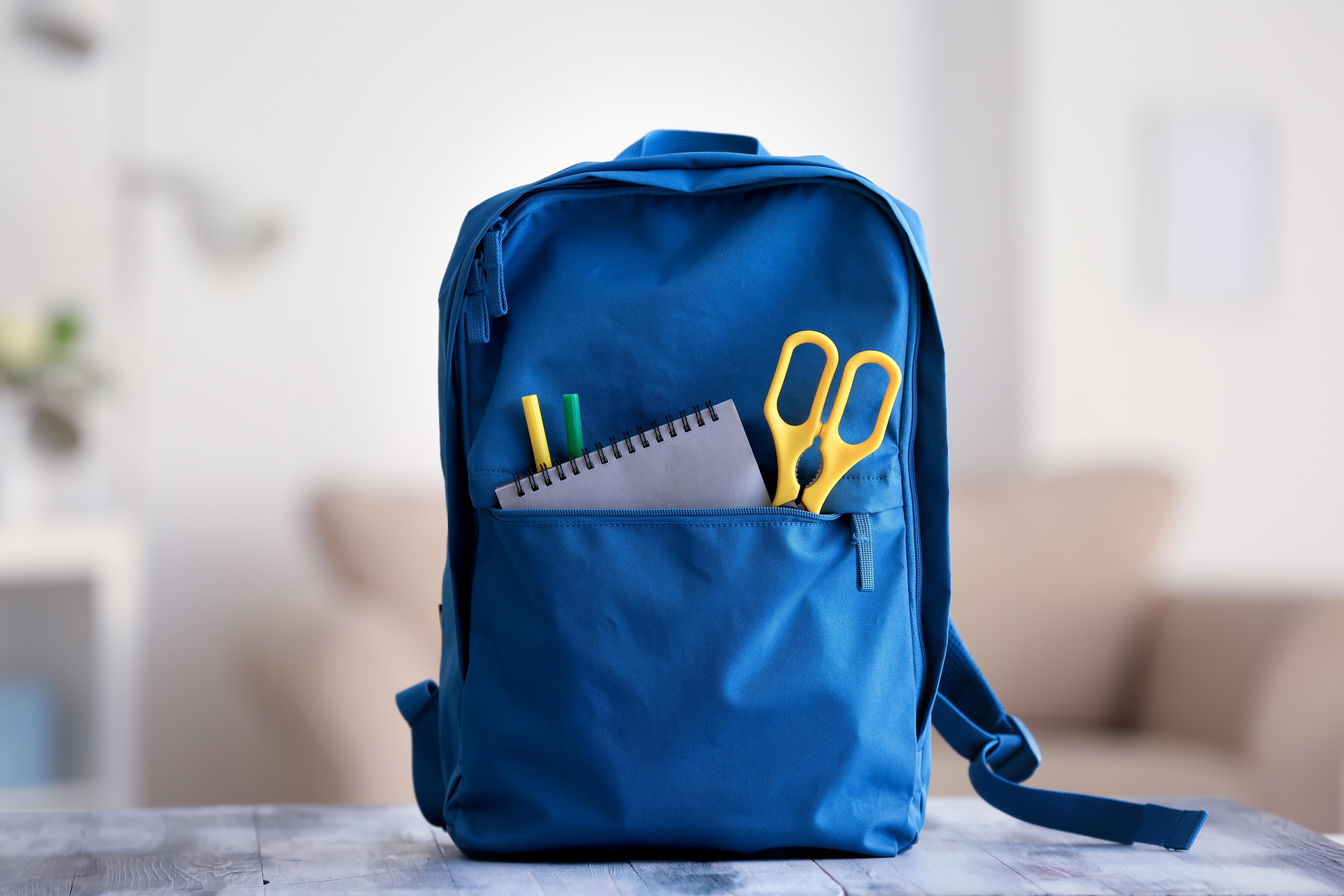 Blue backpack with school supplies