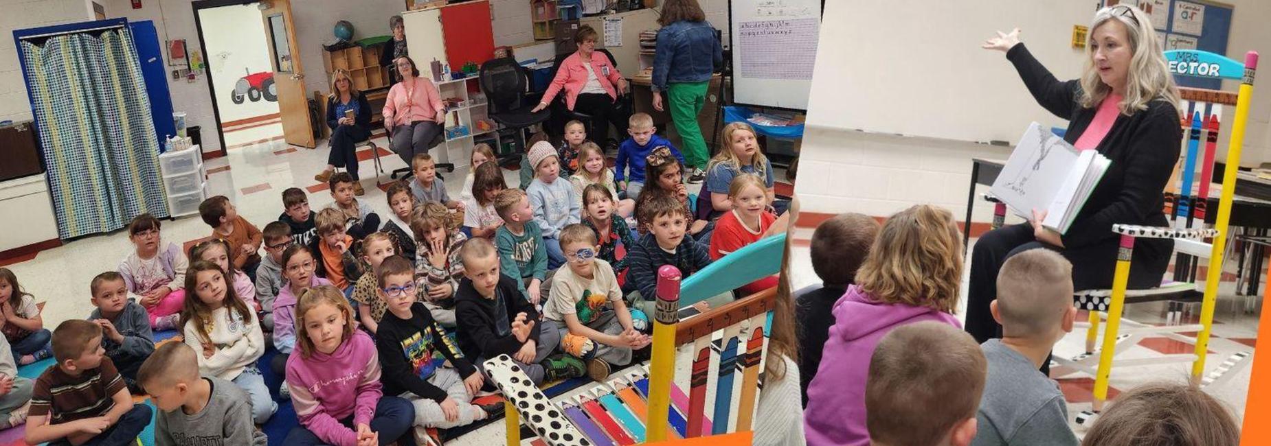 Rocking Reader Diane Frye reading to first grade students