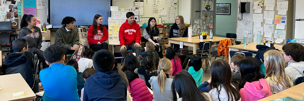 Upper Grades students talk about college with 4th Grade students.