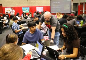 A Whittier High School staff member assists seniors with college applications on laptops during the school’s FutureReady event.