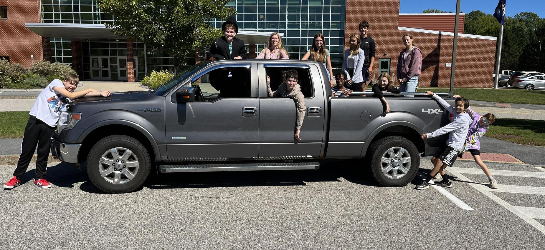 students and a truck