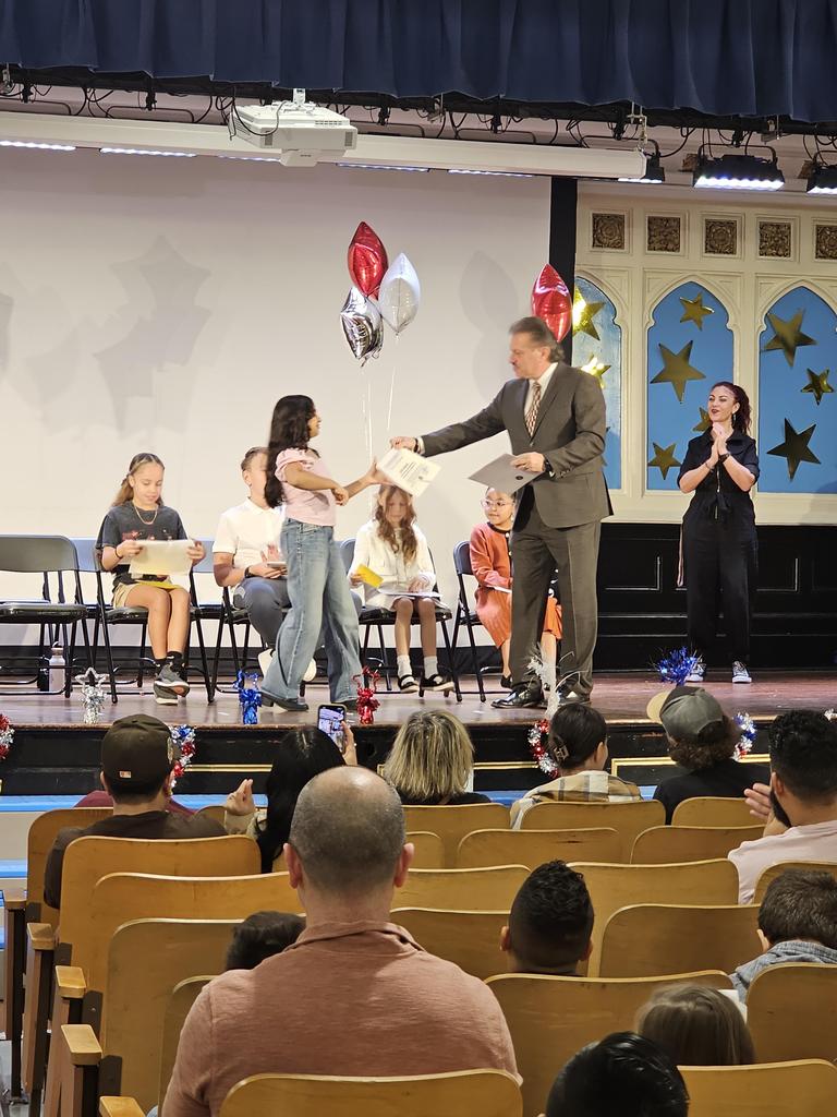 Student receiving their certificate