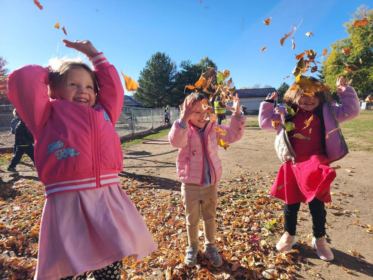 Students at recess with leaves