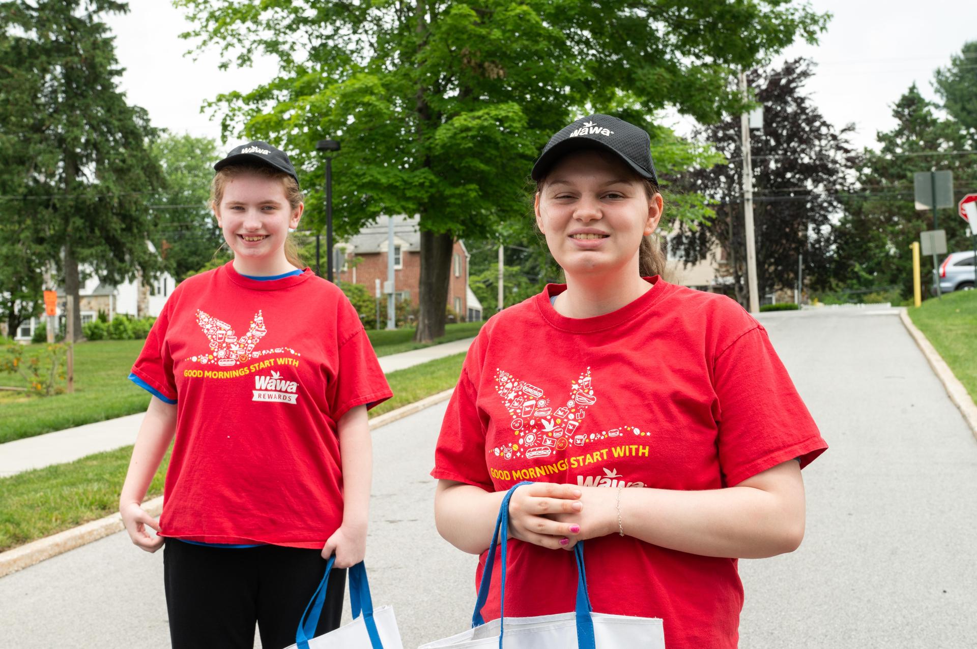 Two students in Wawa shirts going to internship