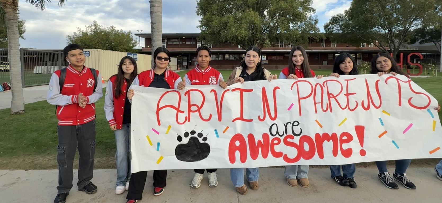 Group of students holding a banner that says 'Arvin Parents are Awesome!'