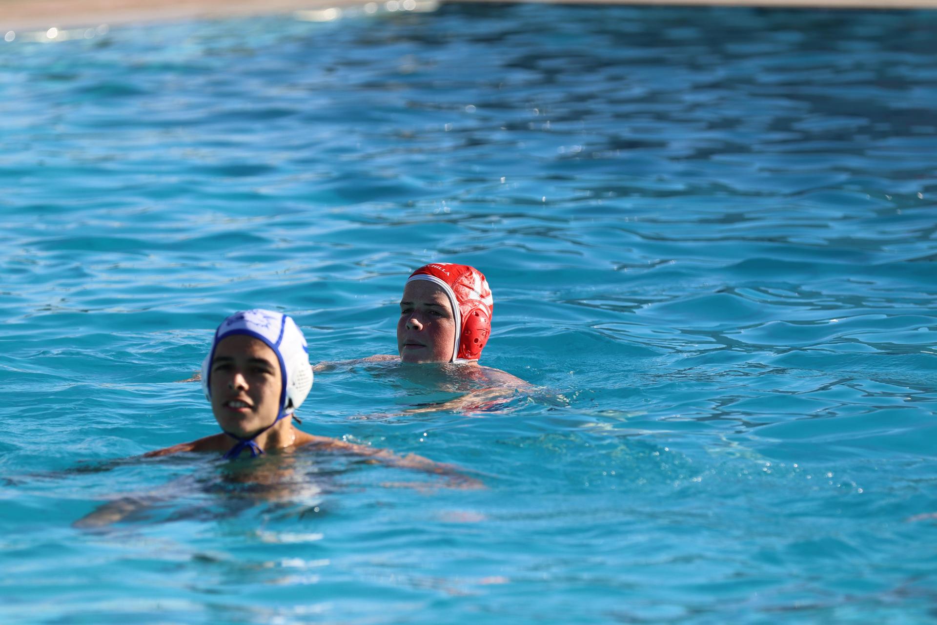 boys playing water polo against Madera