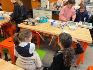Fourth grade girls test their flying trapeze