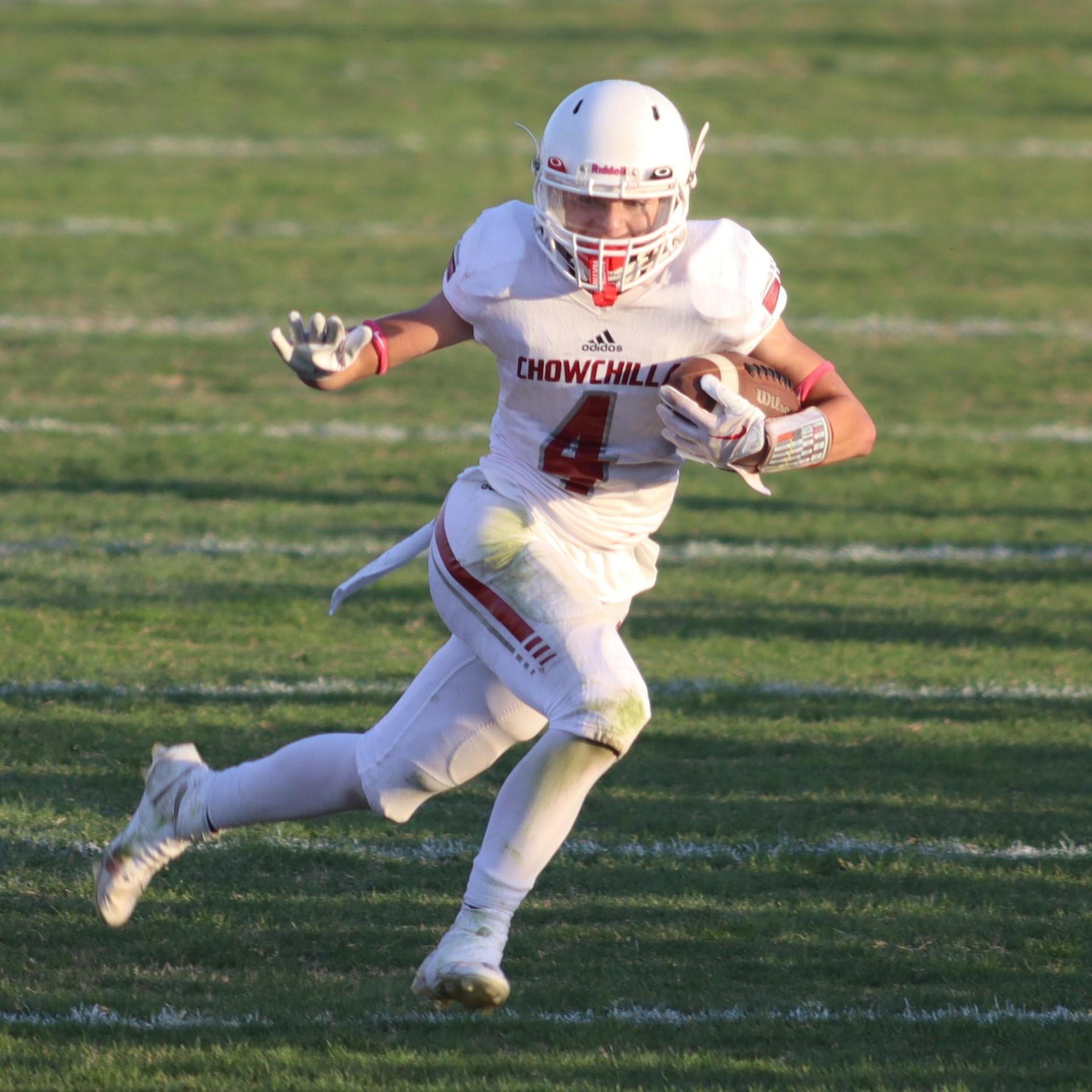 Junior Varsity football players in action against Caruthers