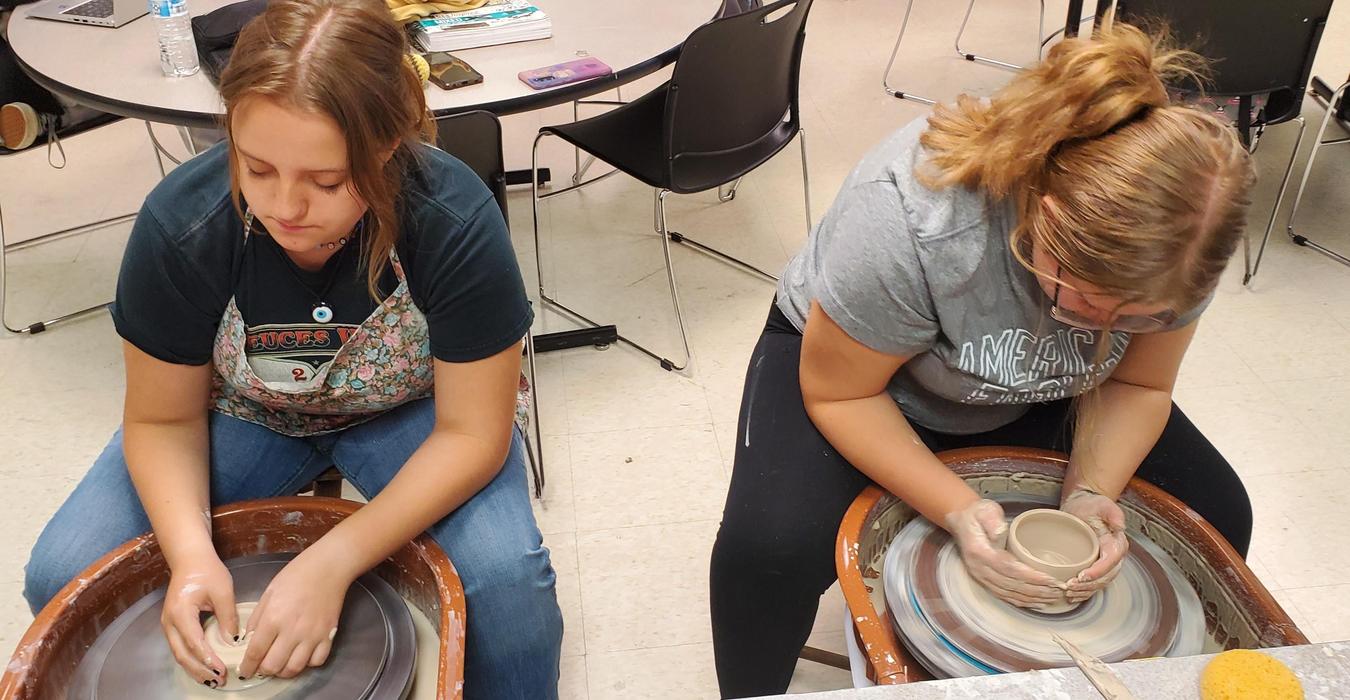 Students working on pottery.