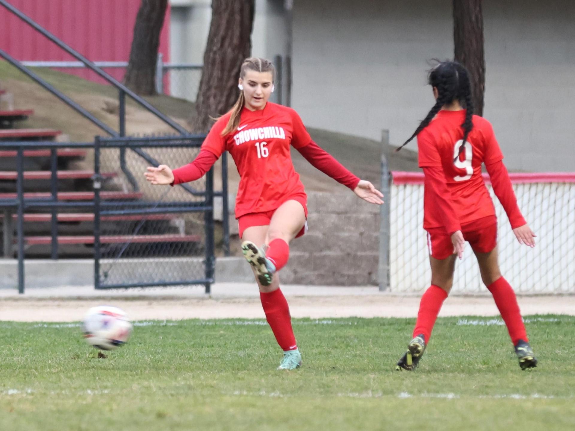 Junior varsity girls playing soccer against liberty