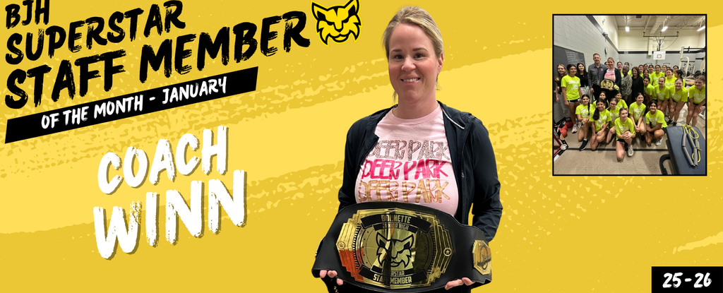 A woman holding a championship belt, celebrating as January's staff member of the month.