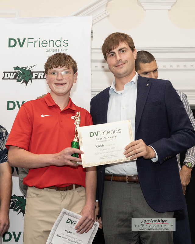Student Receiving award from Coach