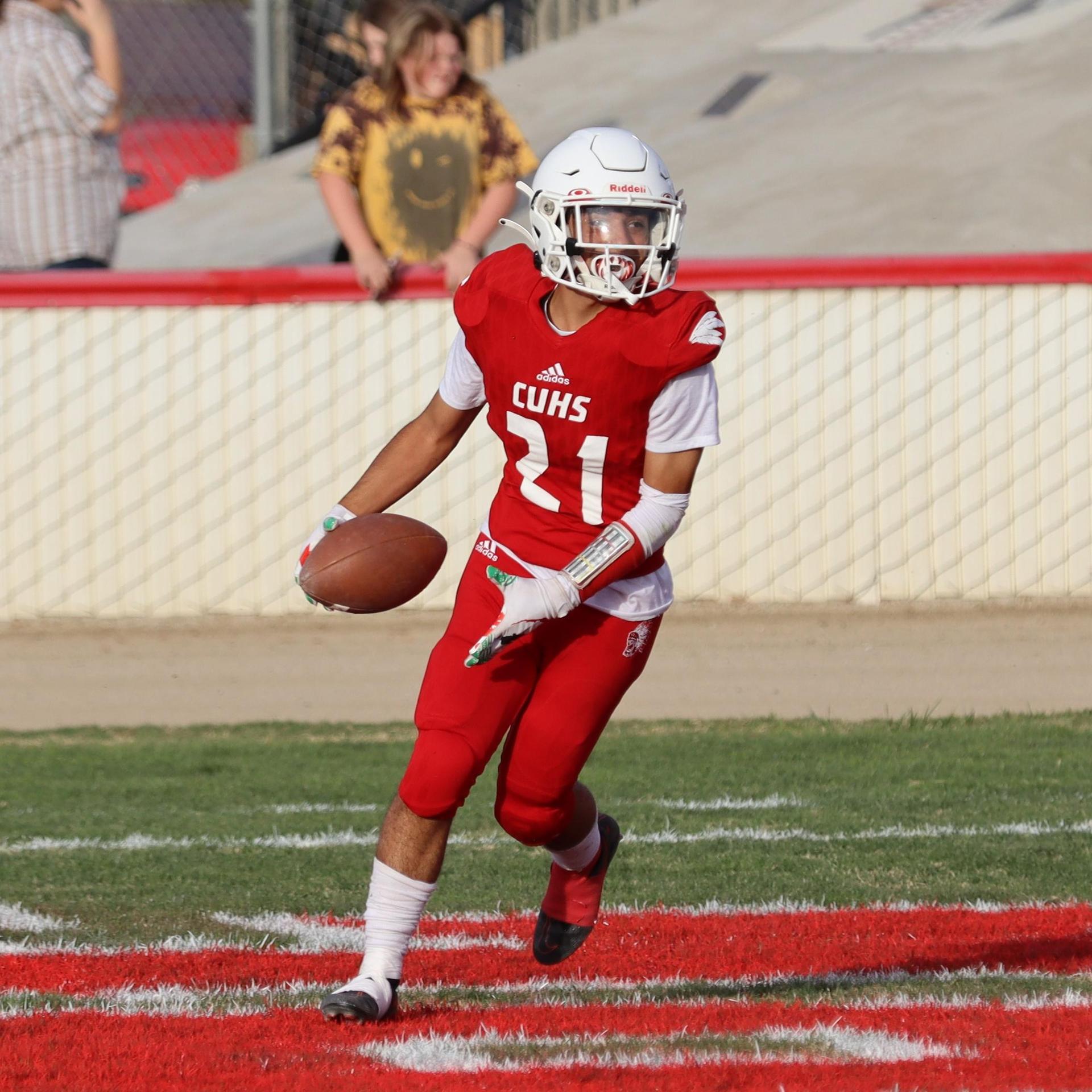  junior varsity football players in action against riverdale