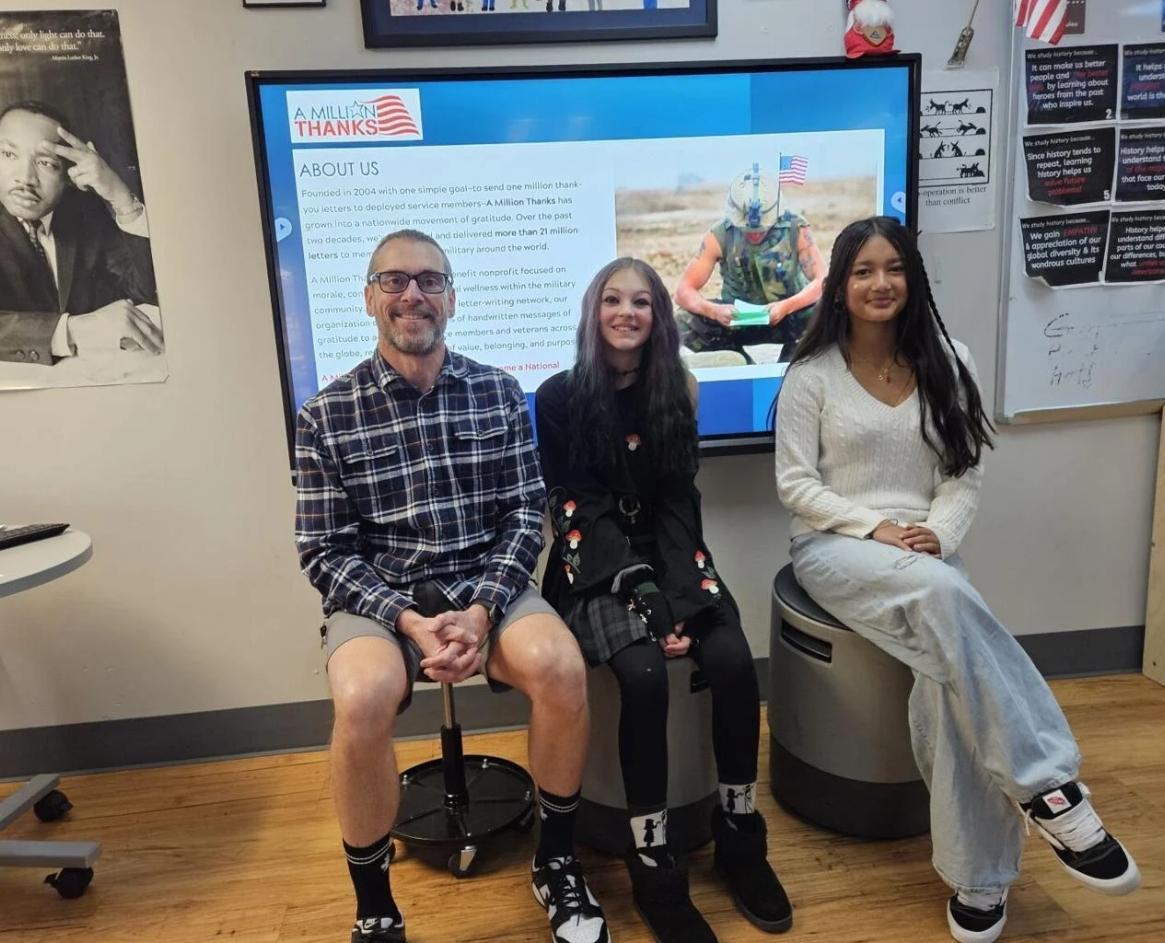 Westgate Community School teacher David Rowan and students Astrid Evans and Chandrama Oli were part of a school-wide effort to thank military members.  By Monte Whaley