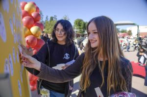 La Serna High School seniors place “I Applied” stickers on a bulletin board.