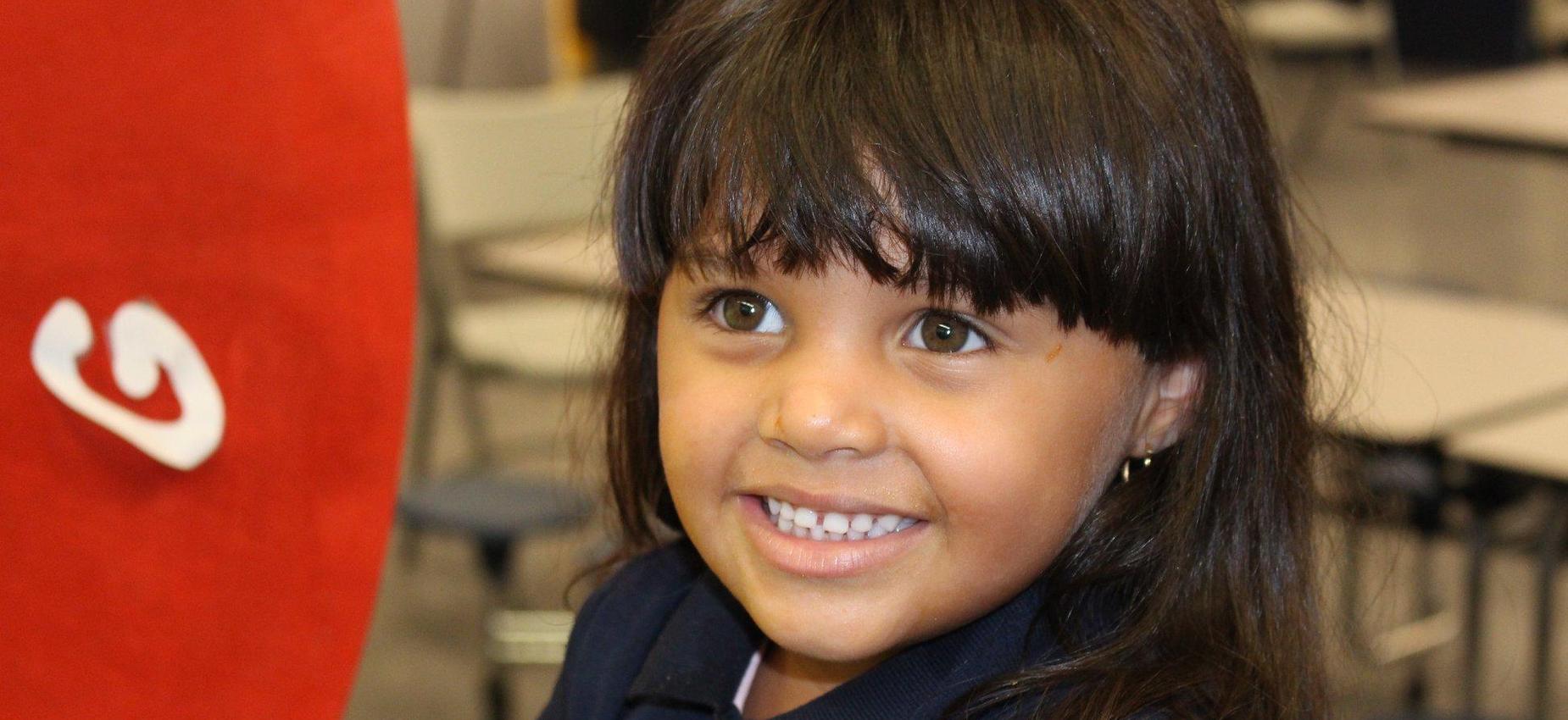 girl smiles at camera