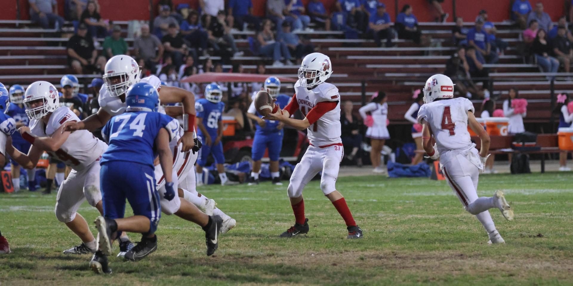 Junior Varsity football players in action against Caruthers
