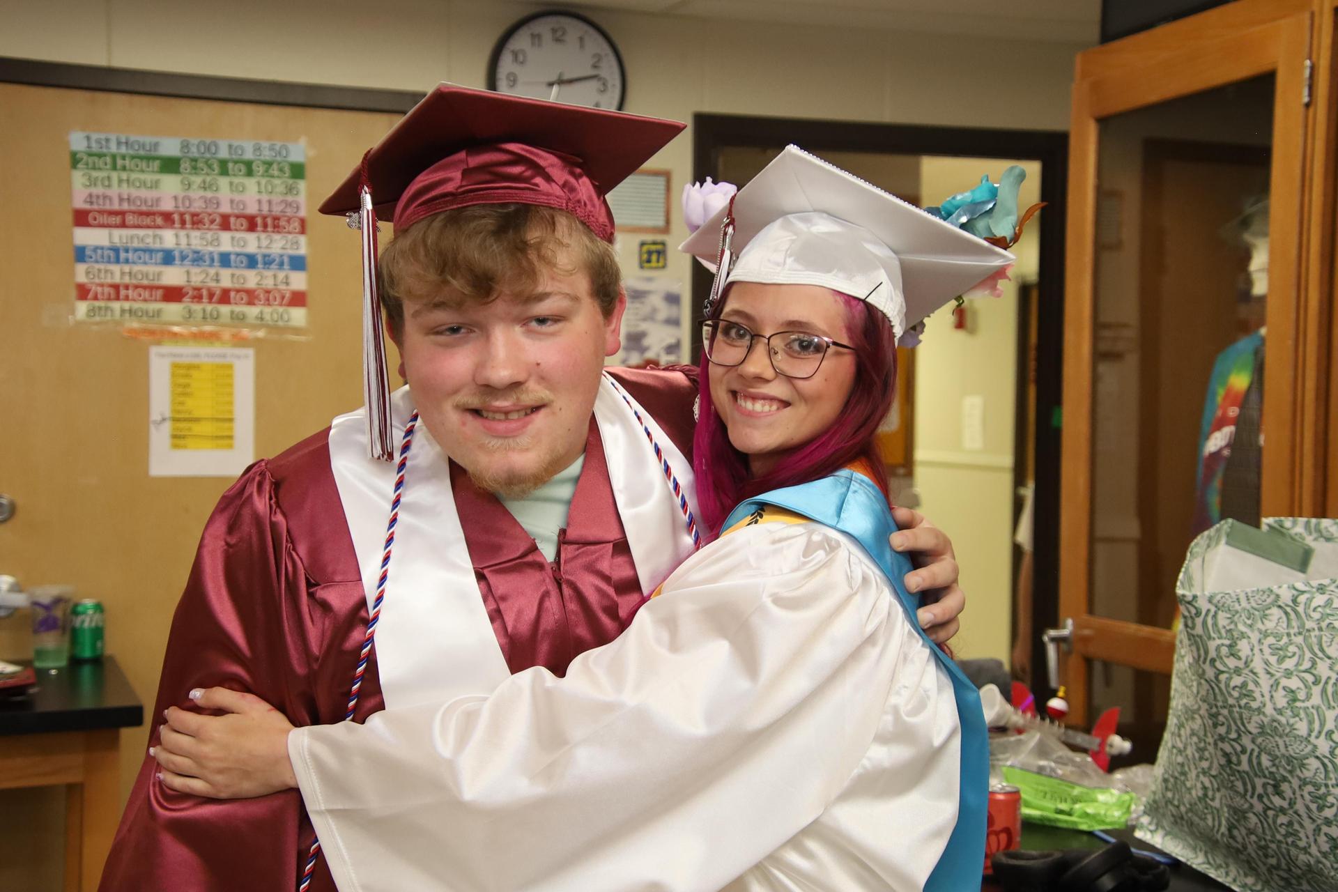 Students smiling at graduation ceremony