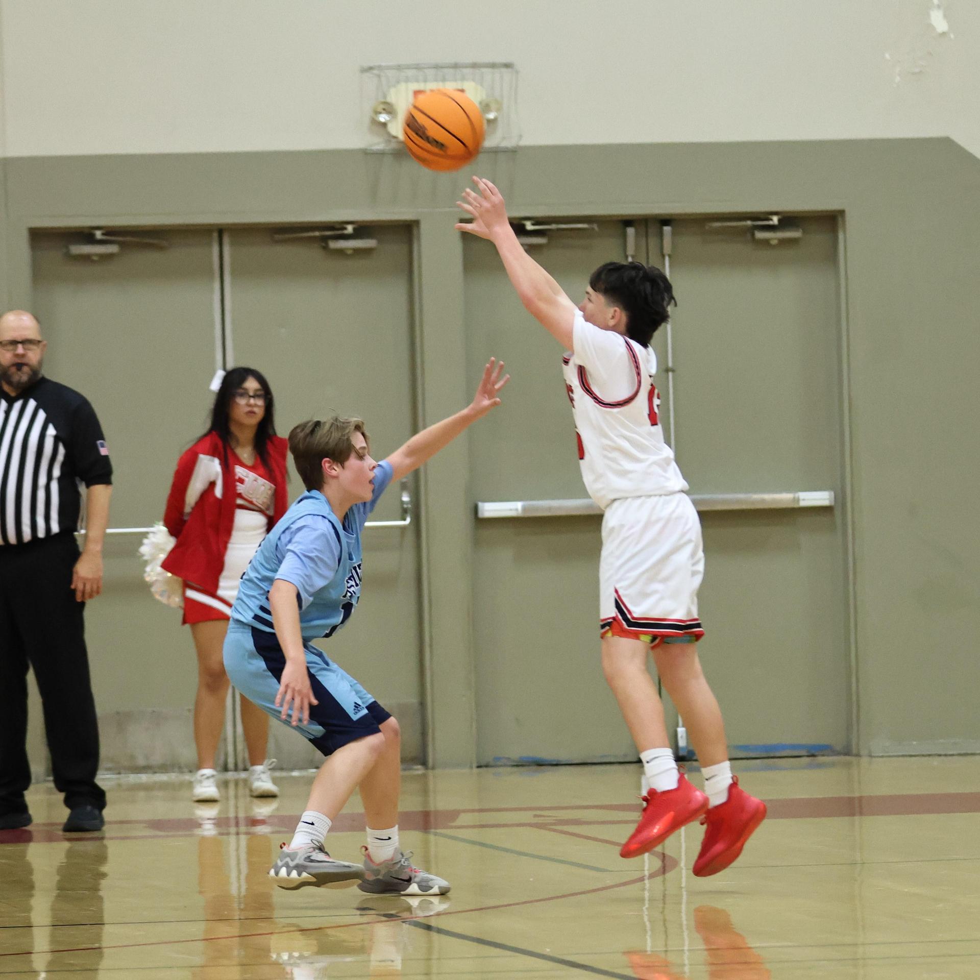 junior varsity boys playing basketball against yosemite