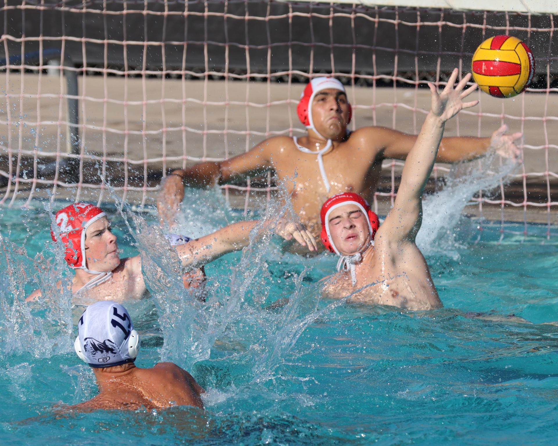 Boys playing water polo against Yosemite