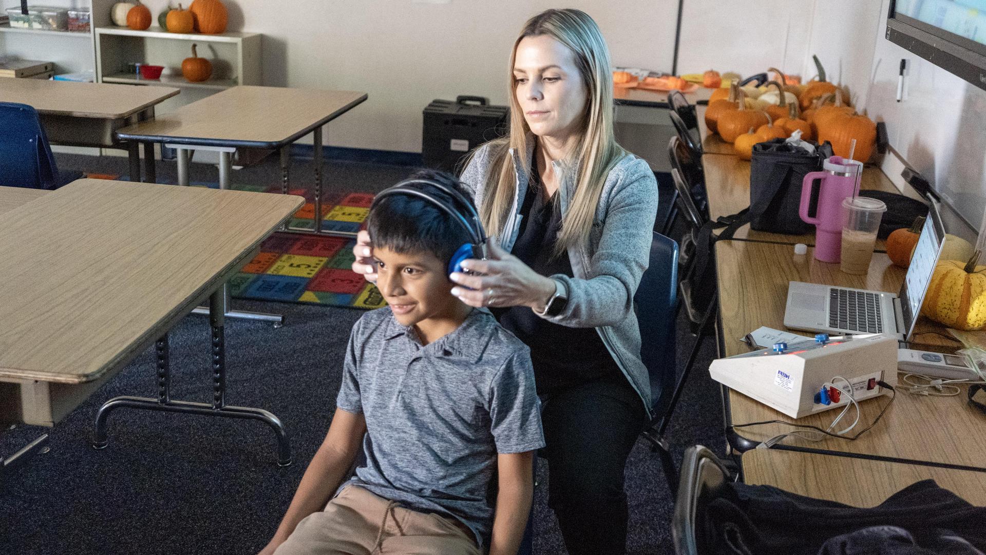 Student receiving a hearing test with headphones.