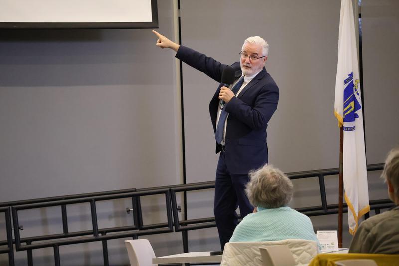 Superintendent Richard Martin talks to crowd about new school proposal