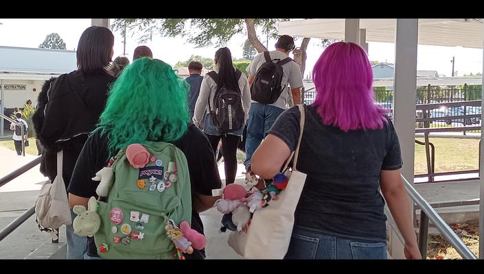 Two female students with colorful hair