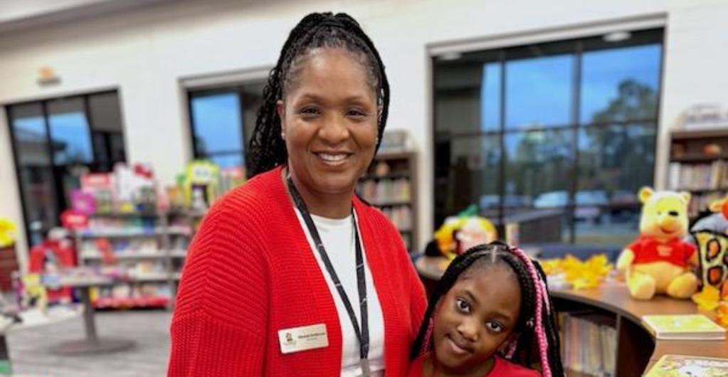 Teacher and student wear red for Red Ribbon Week