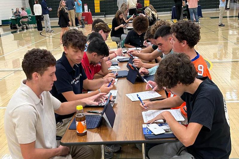 Students fill out applications for the colleges that were in attendance; many led to instant decisions