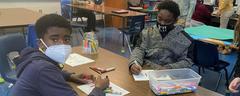 Students working on Christmas door decorations