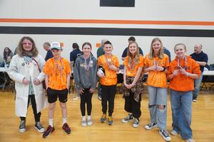 TK students pose with their medals from the regional OM contest.