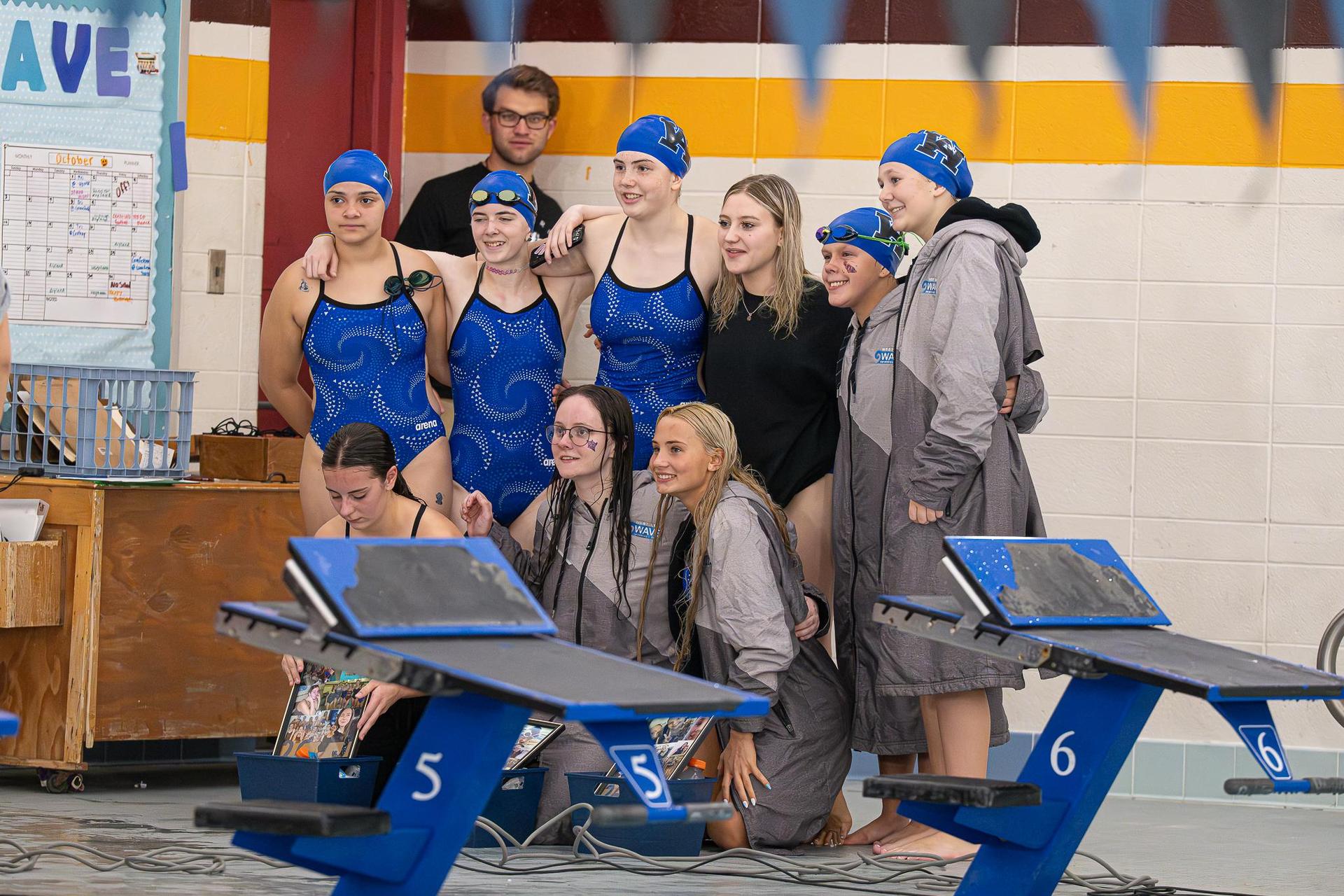 Team photo next to the pool