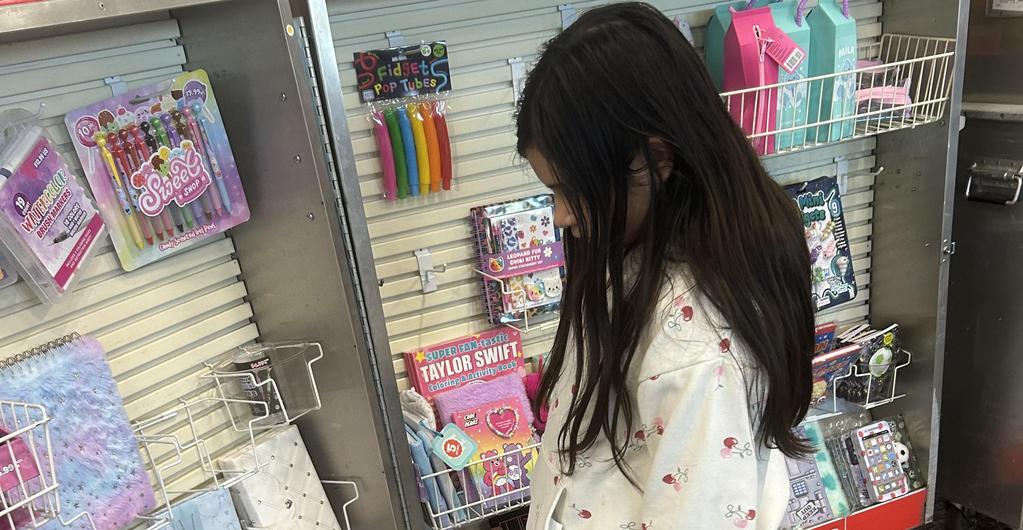 Student shopping at book fair
