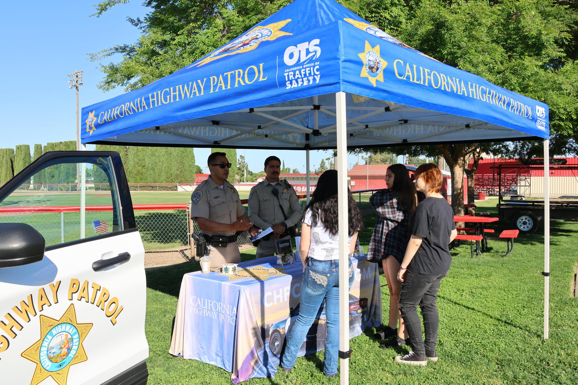 Highway patrol officers speaking to students